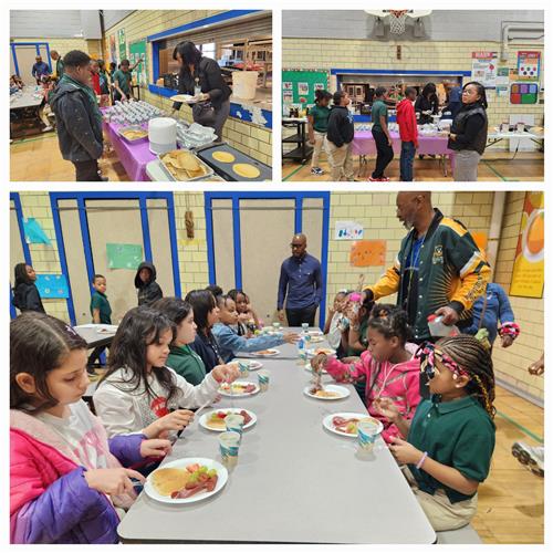 Students taking part in pancake breakfast, seated at tables eating, waiting in line to be served