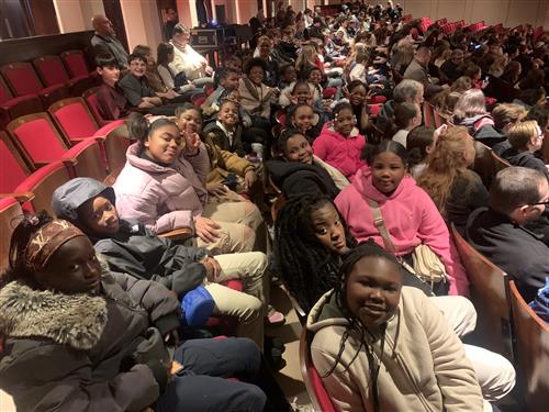 4th grade students sitting in chair at the detroit orchestra hall 