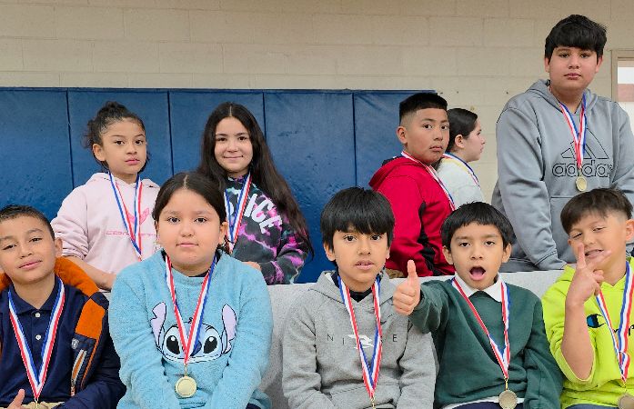 Students posing with award medals.