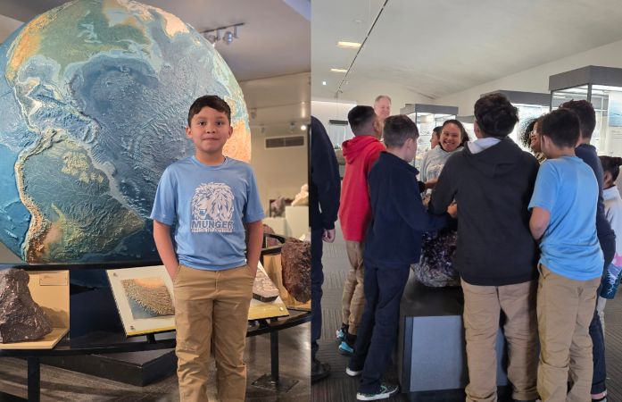  Student posing in front of large globe and students interacting with museum docent