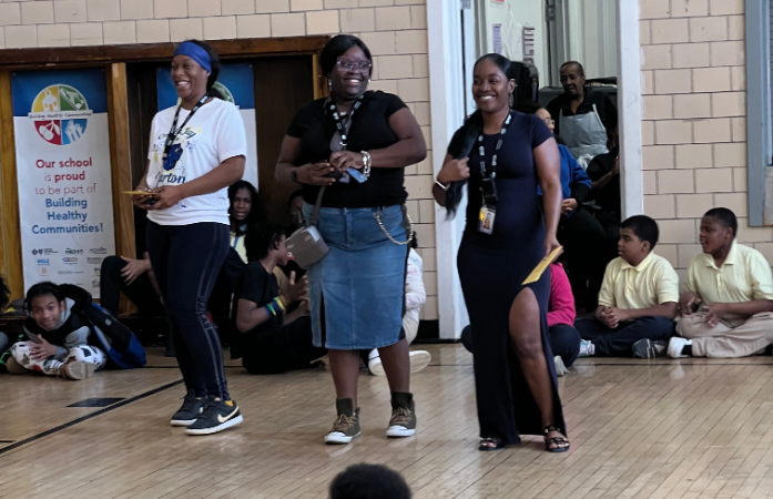 Staff and students in gym