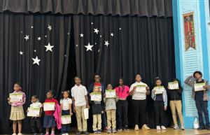  month of September students of the month holding their certificates
