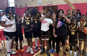  boys basketball team posing