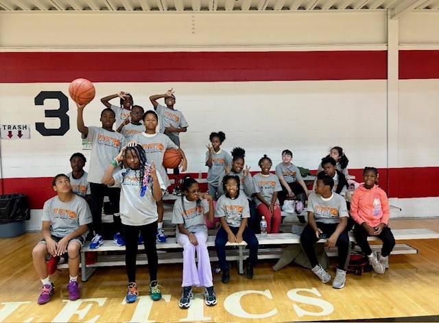  Group of students sitting on the bleachers together