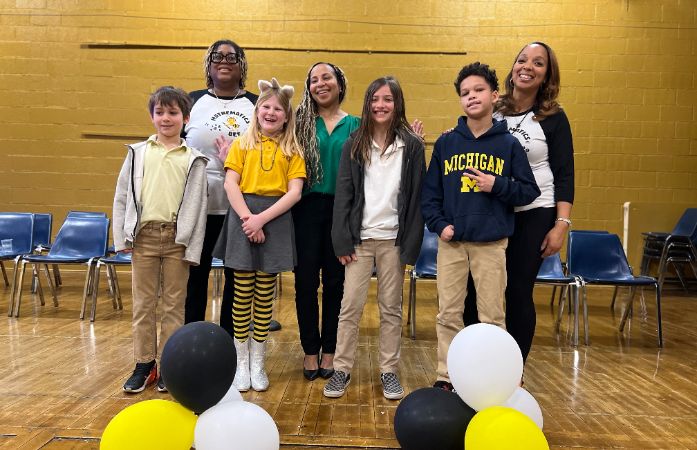  math bee winners and principal and teachers pose for a photo