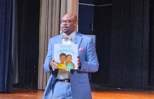  Darnell Blackburn holding the book I Believe I Can by Grace Byers