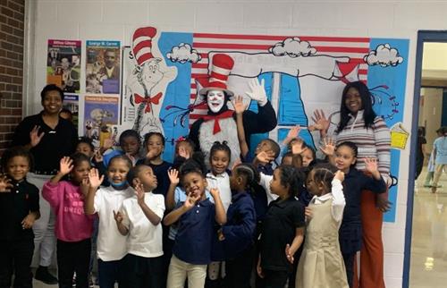  Kindergarten students and teachers posing with The Cat In The Hat.