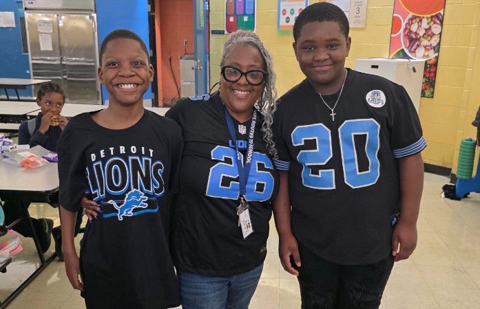  Teacher and student wearing lions gear