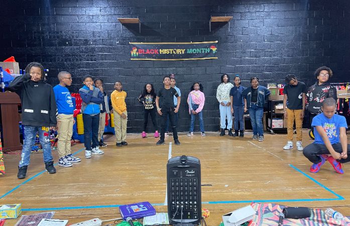  students standing on stage