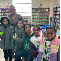 group of students and principal in the library