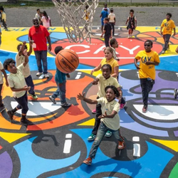 students playing basketball on basketball court