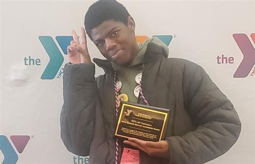  Student holding a plaque