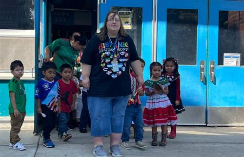 preschool teacher with her class