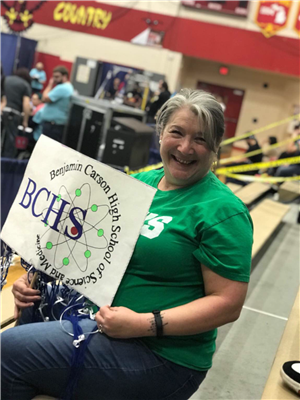 Mrs. Schwendemann cheering on the team at competition 
