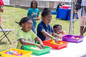 Students playing with kinetic sand