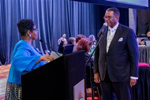  Rev. Dr. Steve Bland at the podium to get sworn in as DPSCD's newest board member