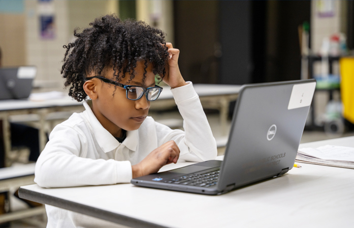 student working on a laptop