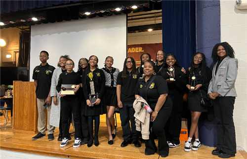  bates debate team, male and female students with 3 female teachers