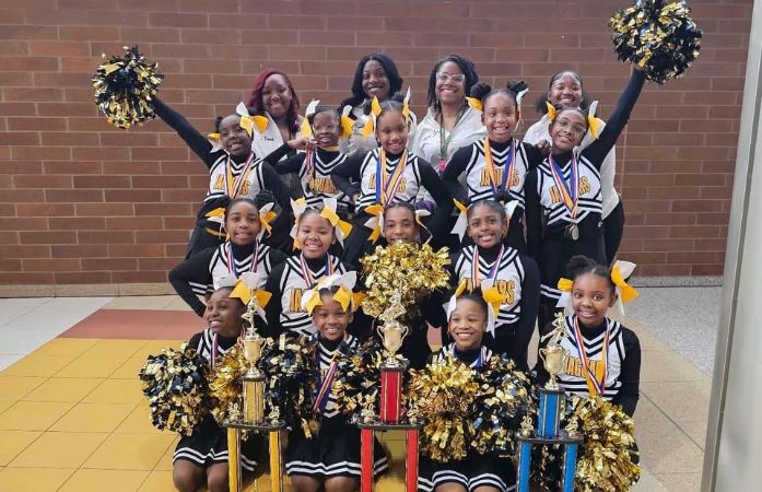  The Elementary Girls Cheer Team with their Coaches