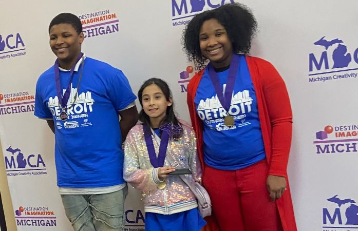  Students standing with medals