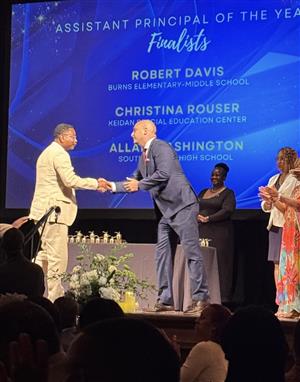 Assistant Principal Mr. Davis accept his nominee award for Assistant Principal of the year.