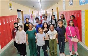  Group photo of choir students standing in the hall