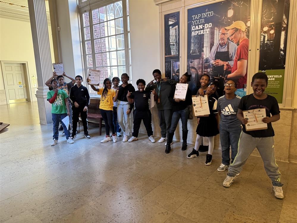  Students on a field trip posing for a picture.