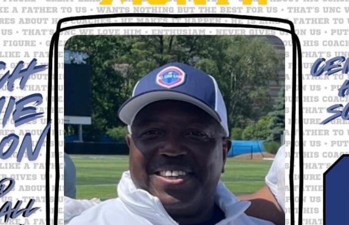  Coach Macon smiling with a hat on..