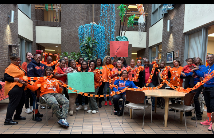 CAY staff with school unity chain