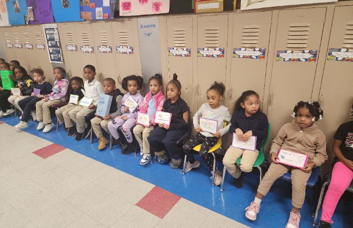  Students sitting in the hallway