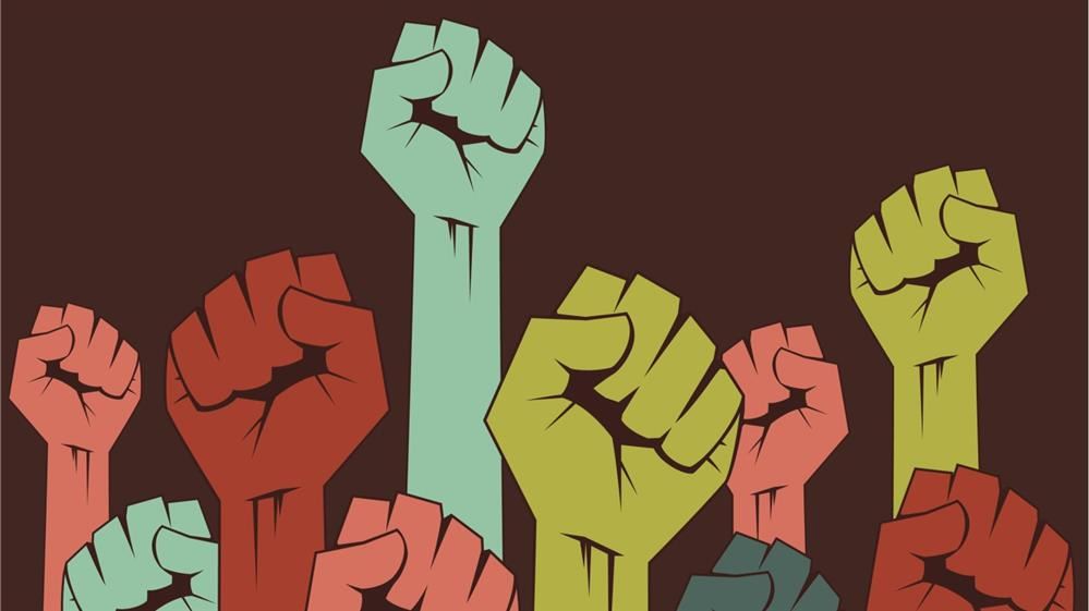 multi-colored human fists multi-colored human fists