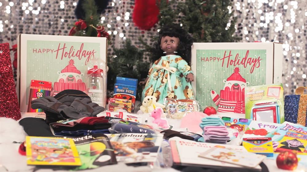 photo of Christmas decorated table with dolls and gifts 