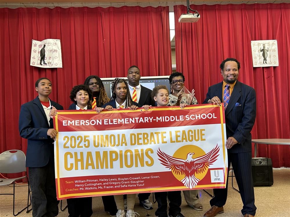  Students and coach holding championship banner.