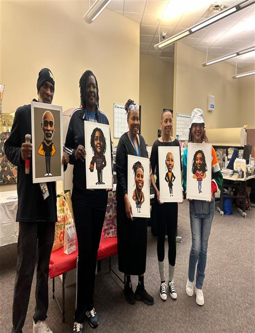 3 people holding artwork