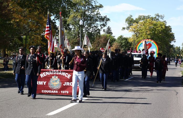  Students marching holding a banner in the street 