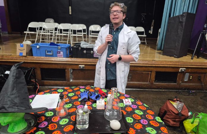  Science Teacher standing in front of table 