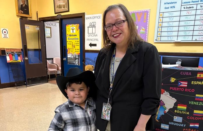  Picture of a kinder student dressed up like cowboy and Principal Ramos smiling for a picture