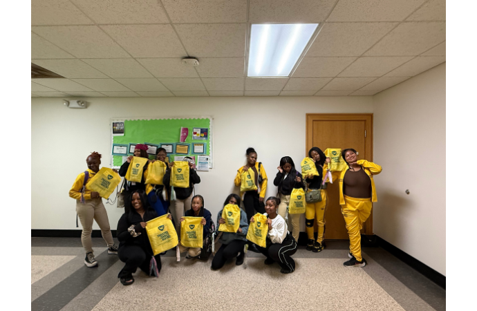  Henry Ford High School dance team members sitting together in chairs at Wayne State University,