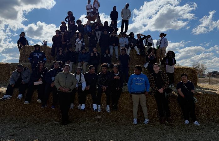  kids and adults on haystacks