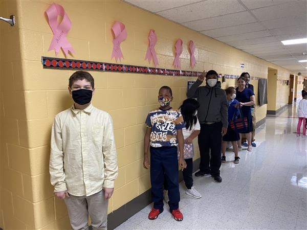 masked students in a line